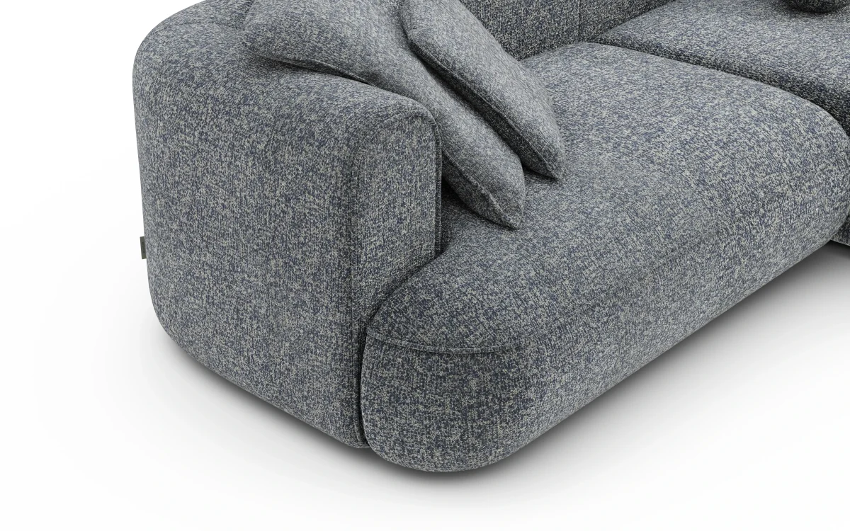 Close-up render of a salt-and-pepper weave on a rounded sofa arm